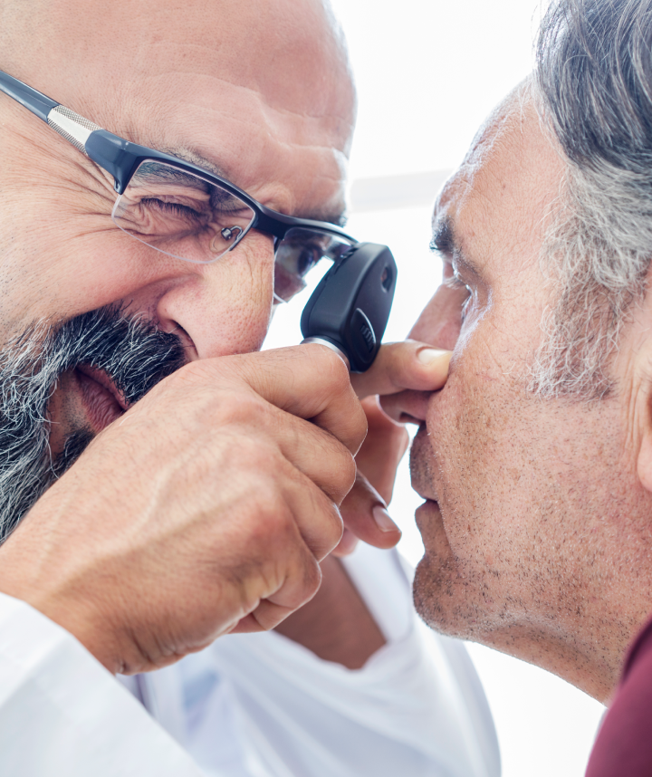 Doctor performing an exam for chronic dry eye